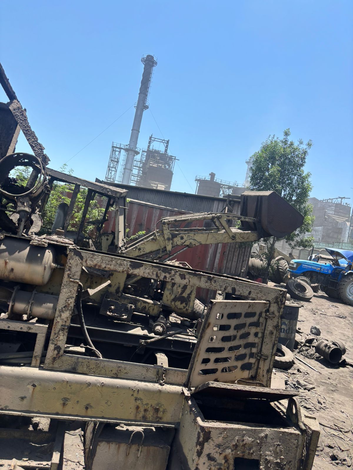 Local industrial scrap — heavy machinery at factory site